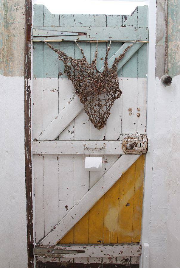 Penny Polkinghorne: "What a tangled web", 2013, Random weaving with Bangalow palm, bamboo, linen thread and copper, 56 x55 cm