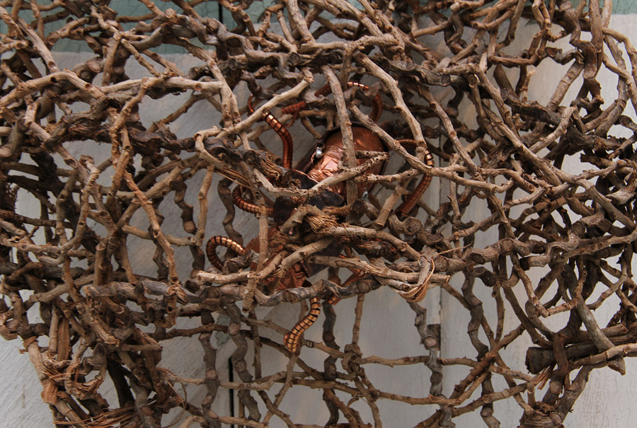 Penny Polkinghorne: "What a tangled web", 2013, Random weaving with Bangalow palm, bamboo, linen thread and copper, 56 x55 cm