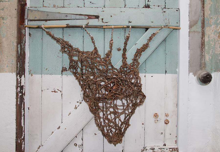 Penny Polkinghorne: "What a tangled web", 2013, Random weaving with Bangalow palm, bamboo, linen thread and copper, 56 x55 cm