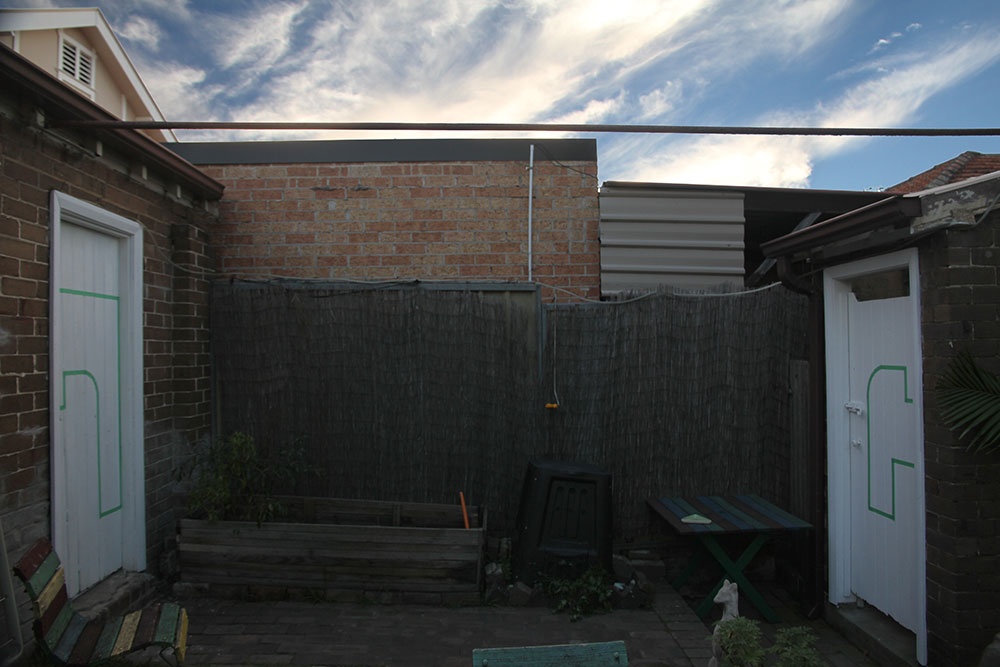 Margaret Roberts: Architectural Composition with Backyard, 2013, installation view. Masking tape on wooden doors
