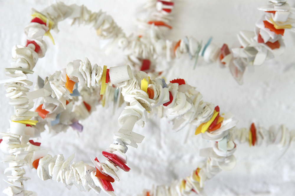 Rox de Luca: Saved Bundles I- V, 2014. found plastics, wire